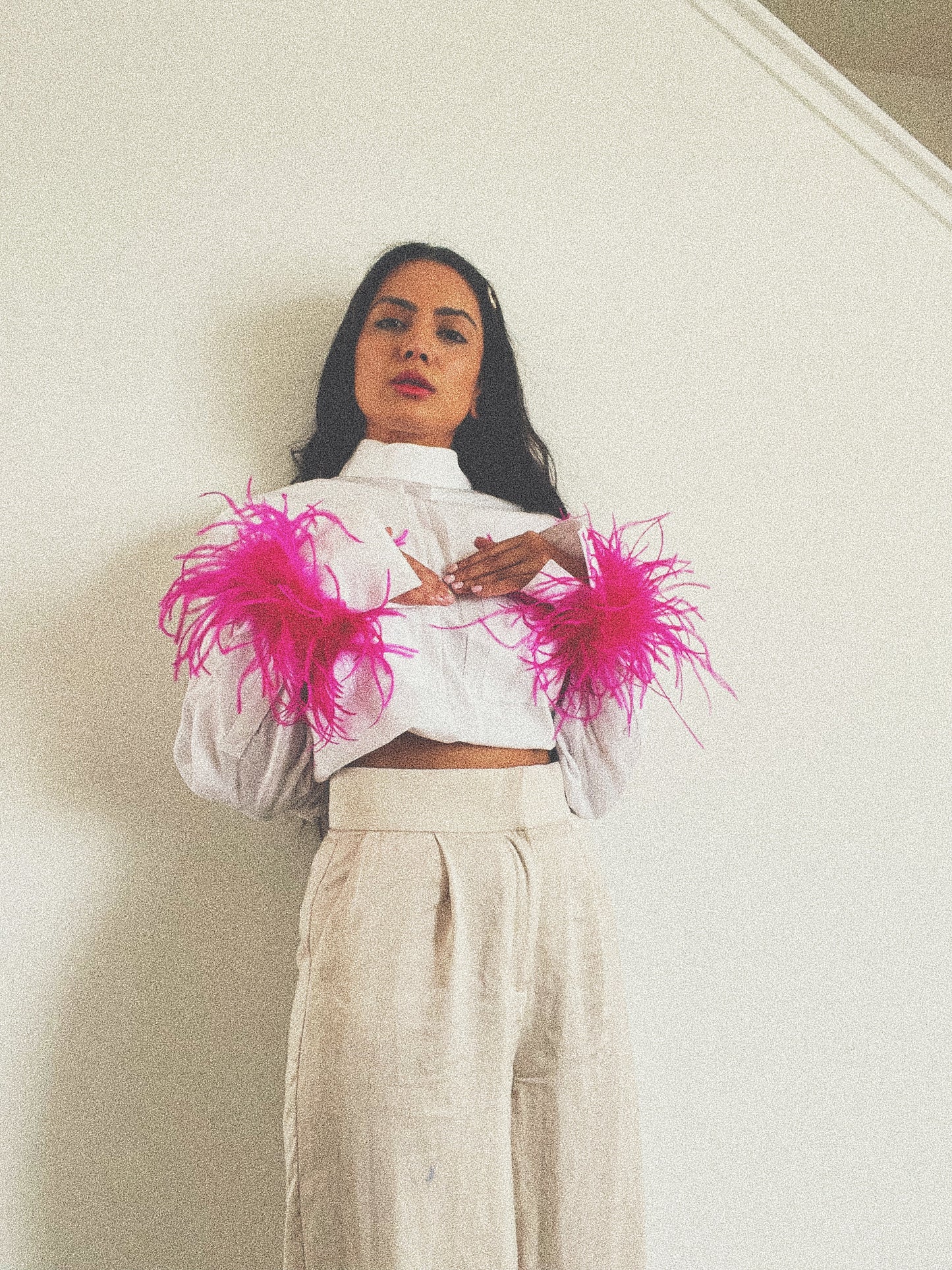Showing how to style our pink feather cuffs on a very simple white and beige outfit