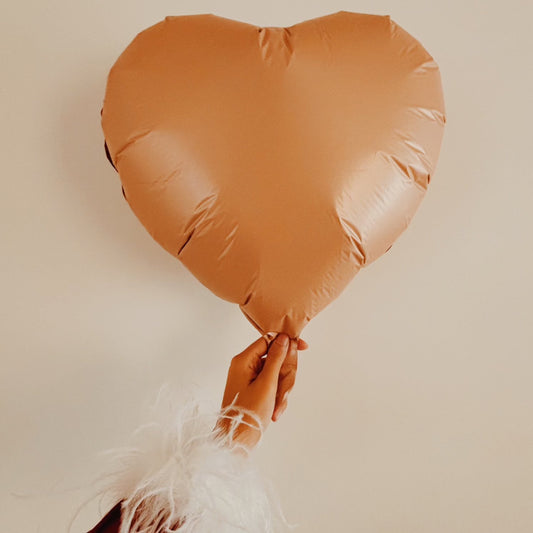 White color feather cuffs that are made on slap bracelets 